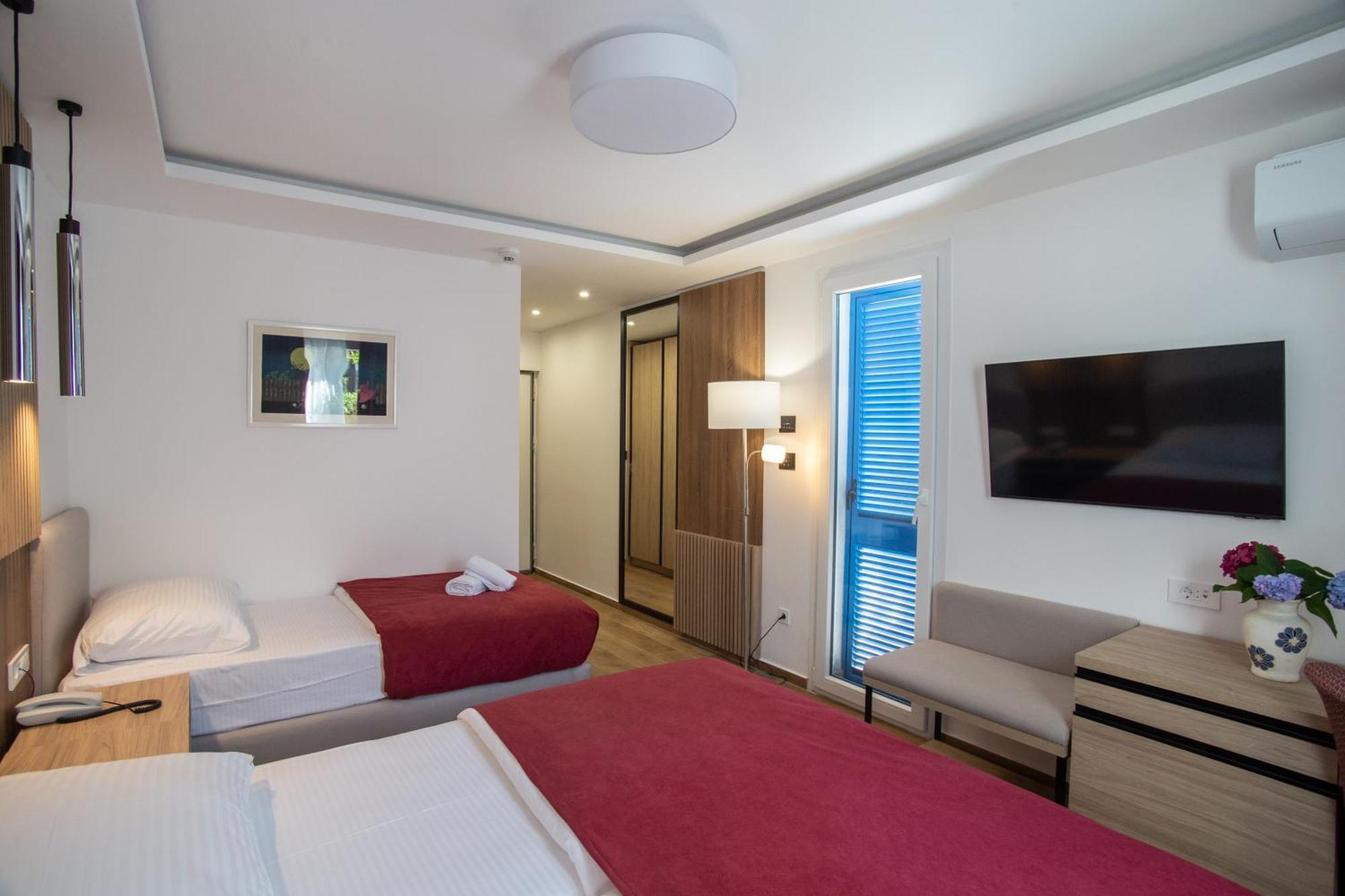 Camera Premium Doppia con Letti Singoli e Letto Supplementare